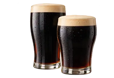 International Stout Day Two glasses of rich, dark stout beer with thick, creamy tan foam and condensation on the glass, displayed against a transparent background in celebration of International Stout Day.